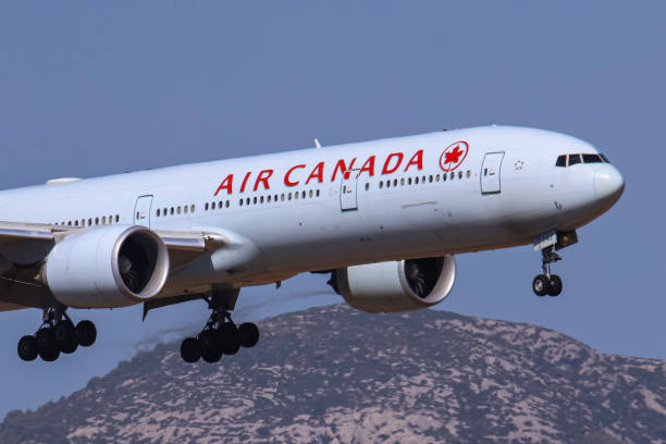 Air Canada Boeing 777-300ER passenger aircraft spotted flying on final approach for landing on the runway of Athens International Airport Eleftherios...