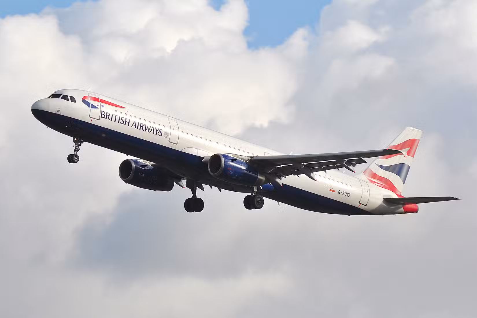 A British Airways Airbus A321 flying in the sky.