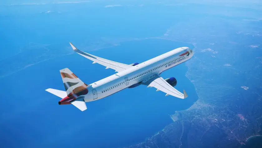 A picture of a British Airways Airbus A321neo aircraft inflight approaching the coast.
