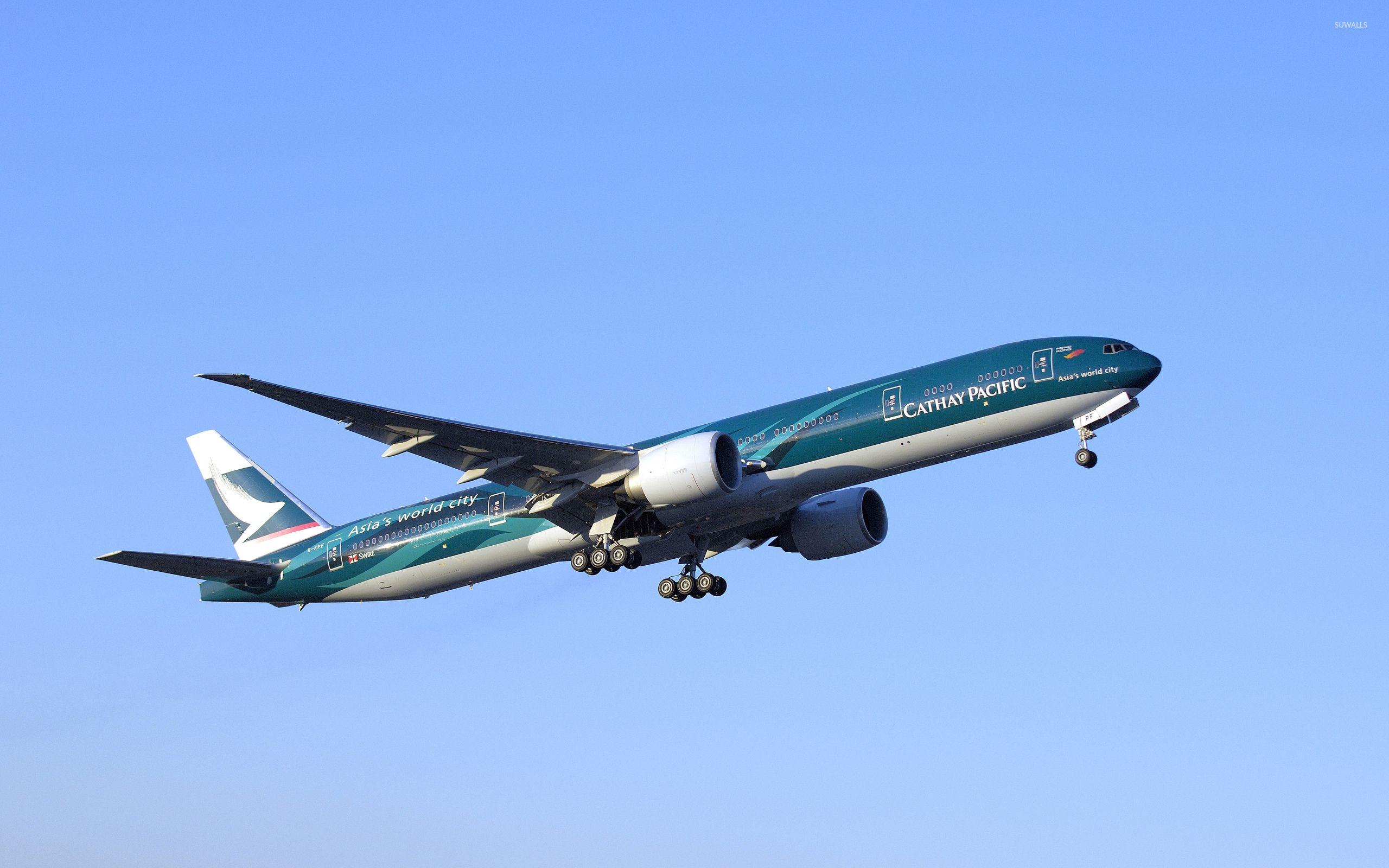 Cathay Pacific Boeing 777 in flight wallpaper