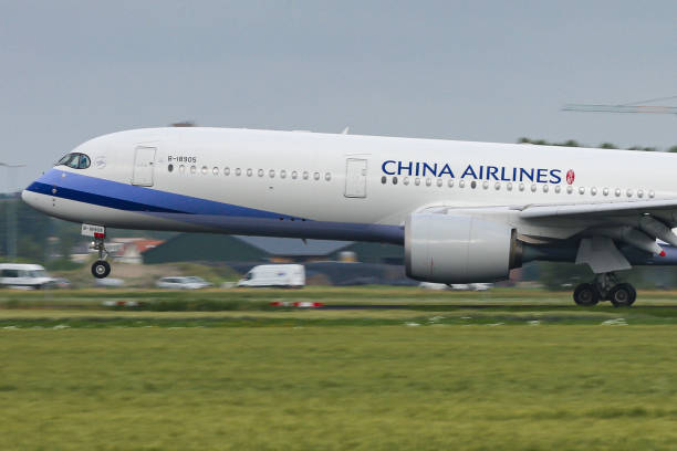 China Airlines Airbus A350-900 aircraft as seen on final approach flying, landing and touching down at Amsterdam Schiphol AMS EHAM International...