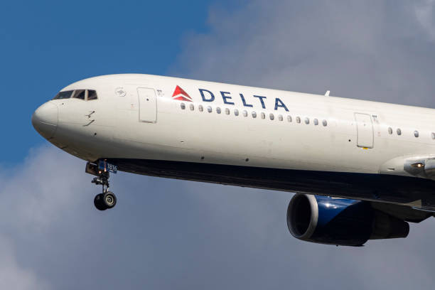 Delta Air Lines Boeing 767-400 aircraft spotted on final approach flying before landing at the runway of London Heathrow Airport LHR in the United...