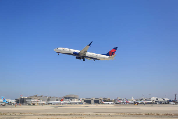Delta Air Lines Boeing 737-932ER Aircraft at LAX Airport Delta Air Lines Boeing 737-932ER0 aircraft N839DN taking off at Los Angeles International Airport in July 2015 boeing 737 delta air lines stock pictures, royalty-free photos & images