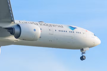 Garuda Indonesia Boeing 777 aircraft landing at an airport
