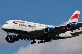 British Airways Airbus A380 Superjumbo passenger aircraft, spotted flying on final approach for landing on London Heathrow Airport runway in the United Kingdom. The double decker wide body airliner is the world's largest jet. The BA A380 airplane has the registration tail number G-XLED and is powered by 4x RR Trent 970 engines. The pictured airplane is arriving from Johannesburg JNB International Airport in South Africa as Flight BA56. British Airways is the flag carrier airline of the United Ki