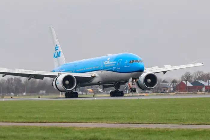 KLM Royal Dutch Airlines Boeing 777 passenger aircraft on the tarmac at an airport.