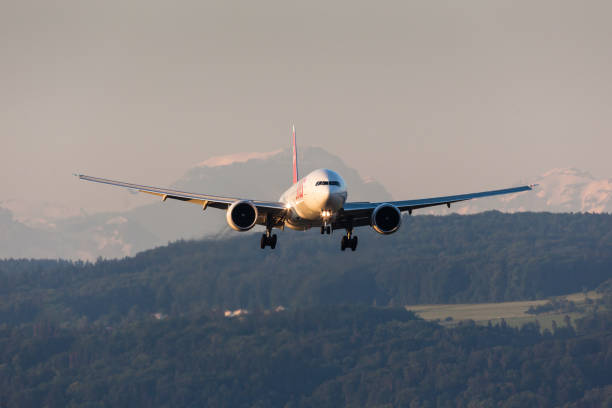 swiss international air lines boeing 777 landing during the first hour of operation after the nightban - swiss airline stock pictures, royalty-free photos & images