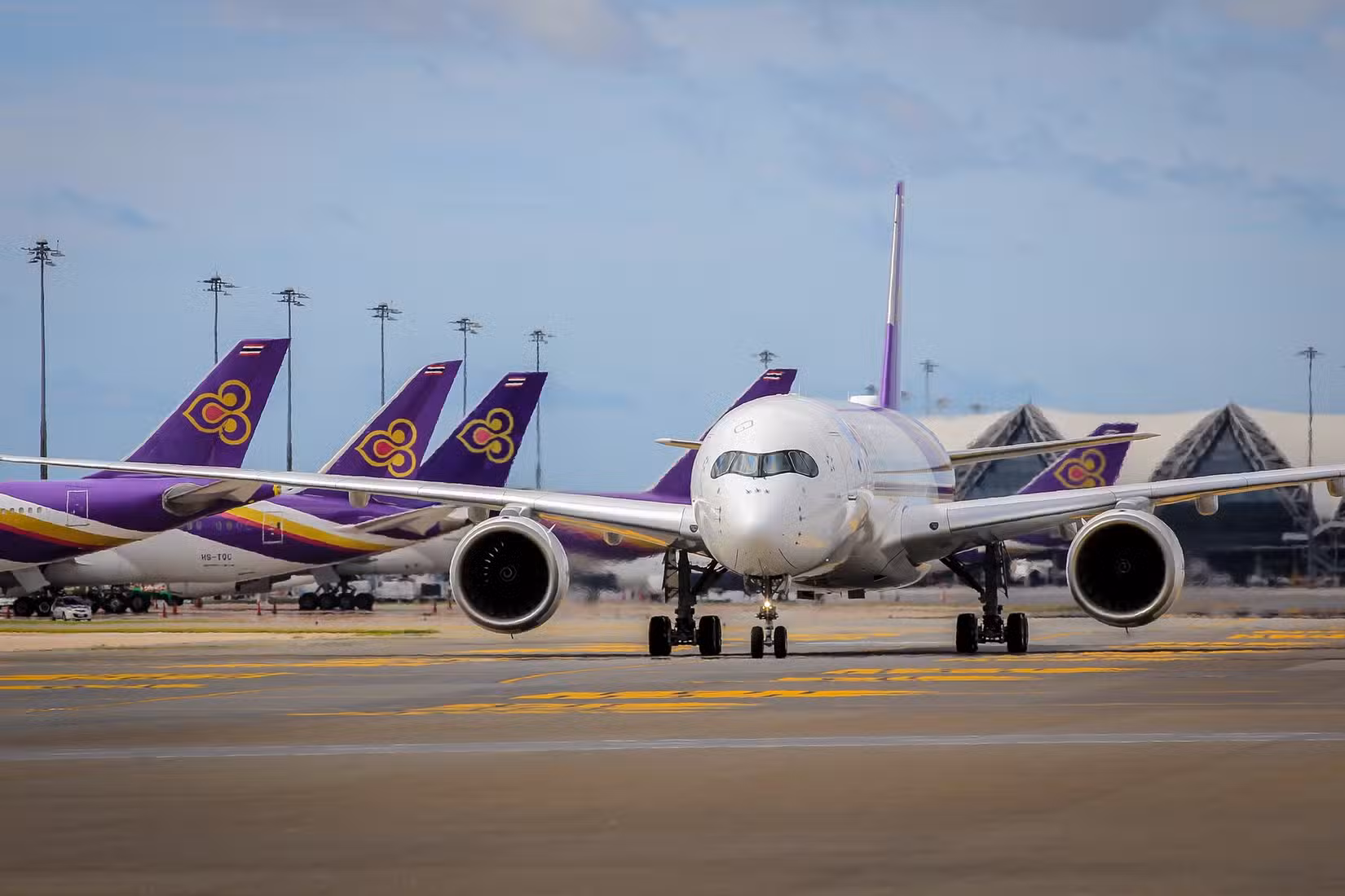 Thai Airways Airbus A350 with other Thai Airways aircraft in the background