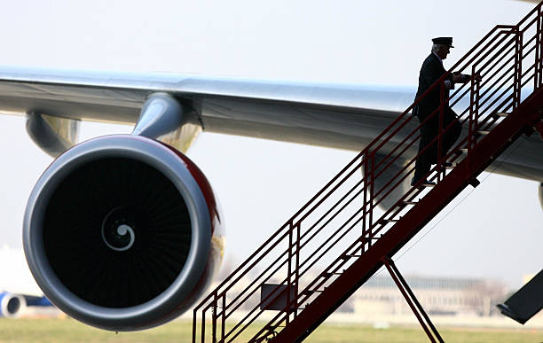 Pilot boards the Virgin Atlantic Boeing 747 before it embarks on the first test flight using bio-fuel made from coconut oil at Heathrow Airport...