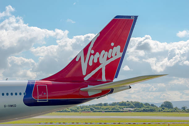 Virgin Atlantic Airways Airbus A340 tail Manchester, United Kingdom - August 07, 2015: Virgin Atlantic Airways Airbus A340 tail livery at Manchester Airport. virgin atlantic stock pictures, royalty-free photos & images