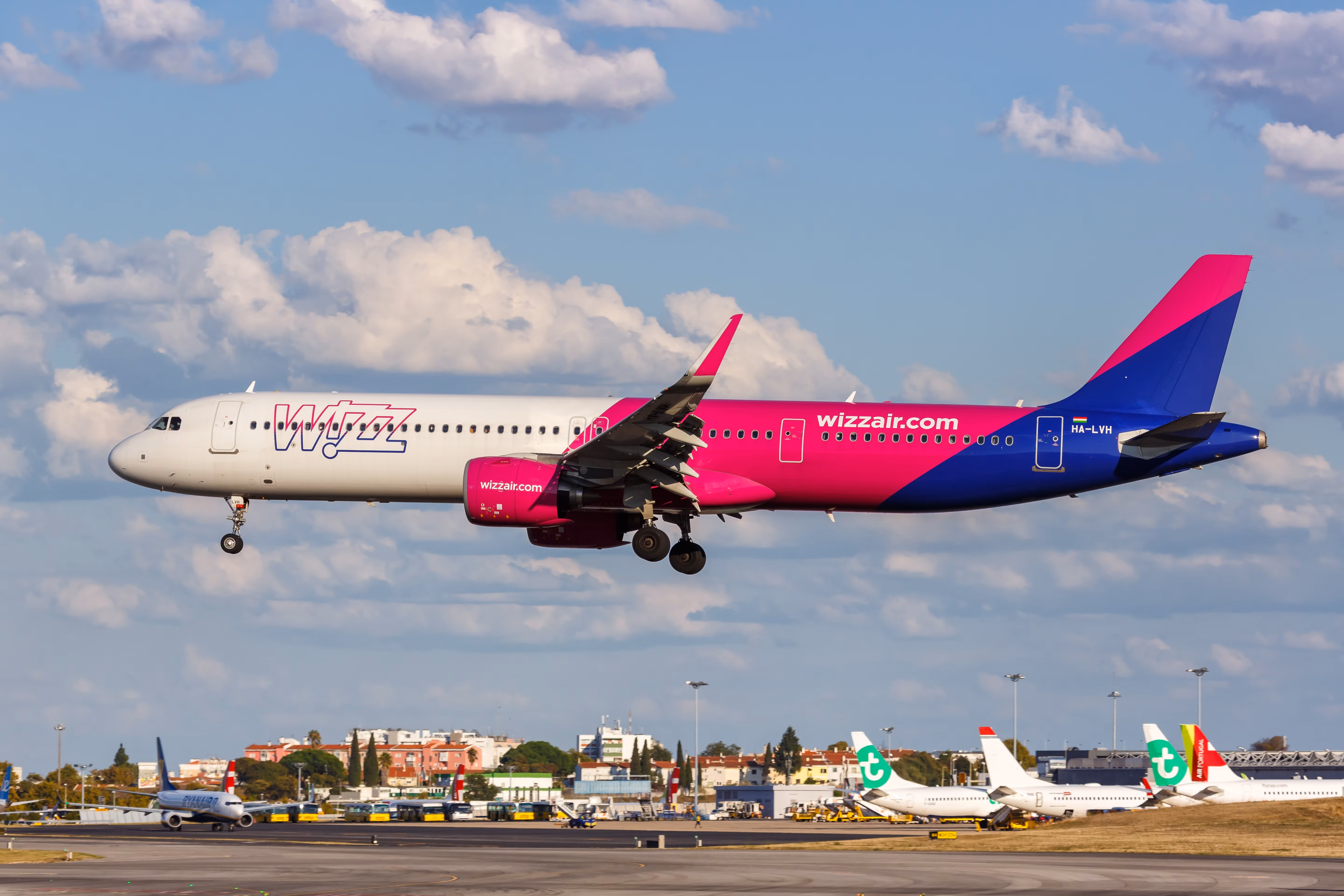 Wizz Air Airbus A321neo landing at Lisbon Airport LIS shutterstock_2110428791