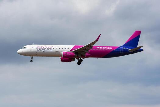 Wizz Air passenger plane at airport. Schedule flight travel. Aviation and aircraft. Air transport. Global international transportation. Fly and flying. photo