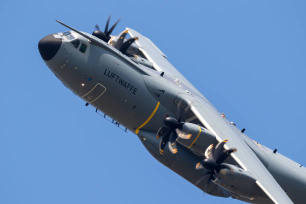 Airbus A400M military heavy-lift cargo plane WUNSTORF, GERMANY - JUNE 9, 2018: German Air Force (Luftwaffe) Airbus A400M military transport plane in flight. a400m stock pictures, royalty-free photos & images