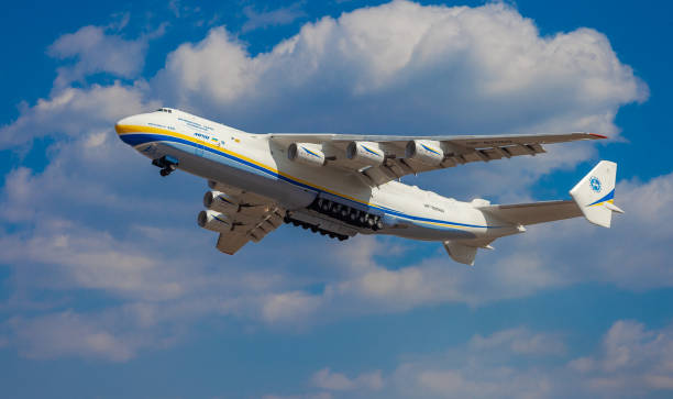 The plane Antonov 225 AN-225 Mriya, the biggest airplane in the world taking off from the airport. Largest aircraft flying in the sky. Antonov airlines. Ukrainian cargo plane AN225 Gostomel, Ukraine - April 11, 2020: The plane Antonov 225 AN-225 Mriya, the biggest airplane in the world taking off from the airport. Largest aircraft flying in the sky. Antonov airlines. antonov plane stock pictures, royalty-free photos & images