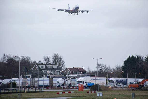 Silk Way West Airlines Jumbo Jet Boeing 747-400F freight edition cargo aircraft as seen flying and landing at Amsterdam Schiphol Airport AMS EHAM...