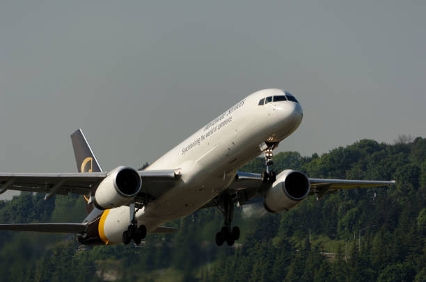 A UPS United Parcel Service Boeing 757-200 freighter climbing out after take-off.