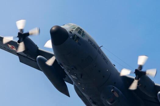 Polish Air Force Lockheed C-130 Hercules transport plane flying. Aviation and military aircraft. photo