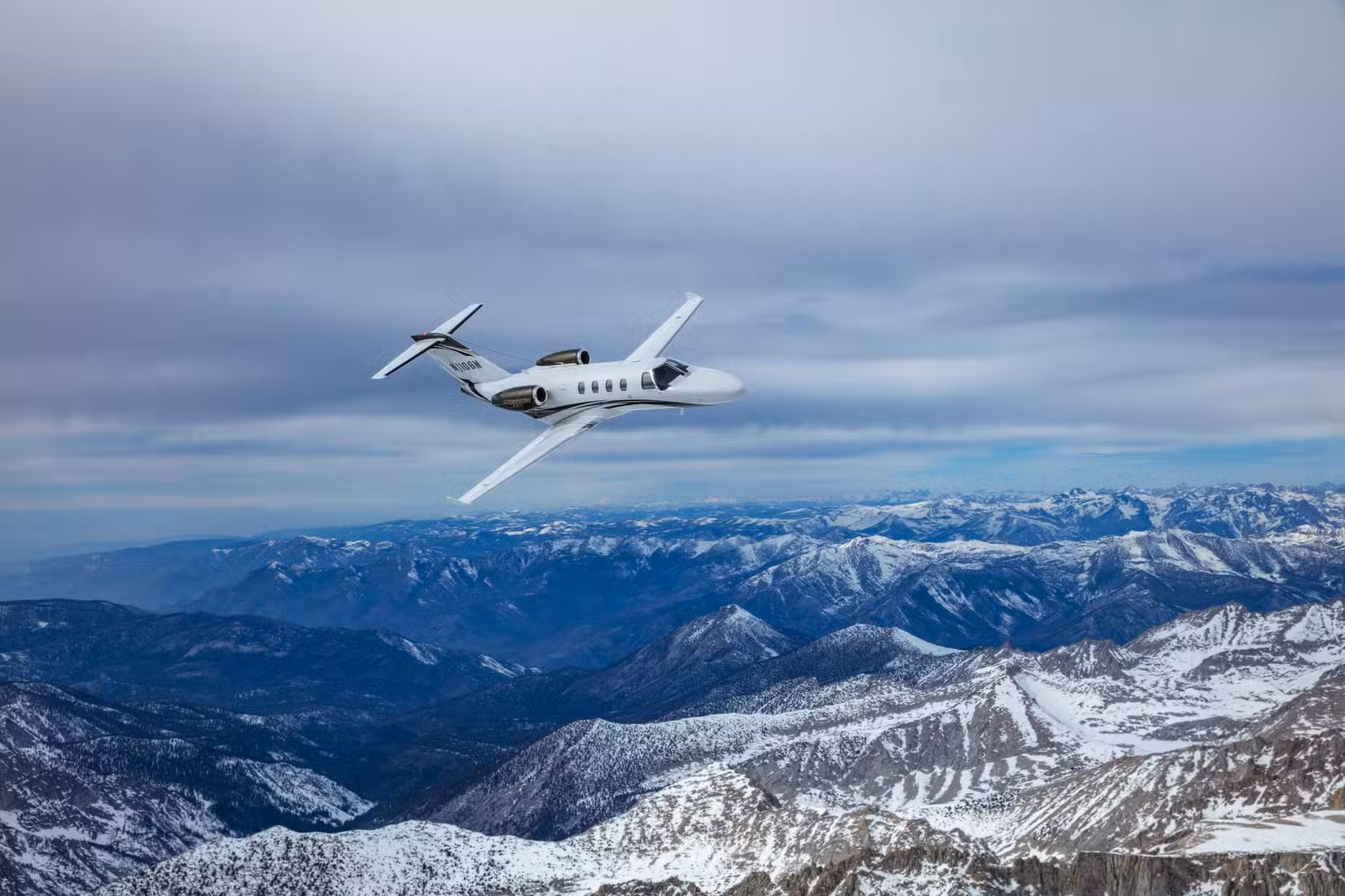 A Cessna Citation M2 Gen2 flying in the sky.