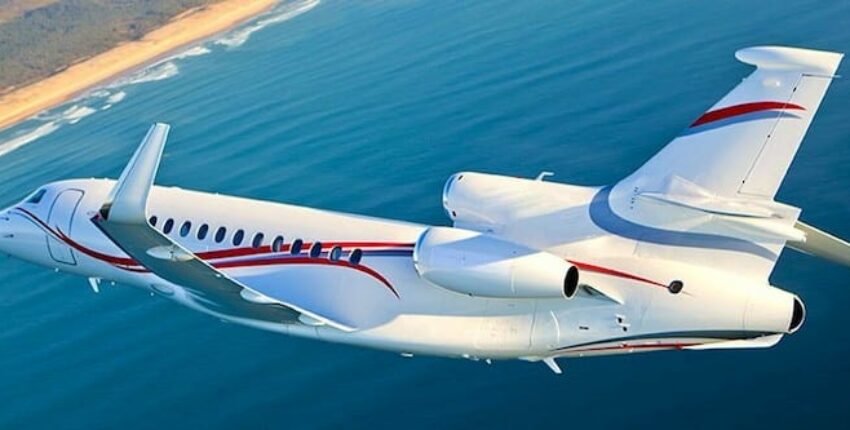 Dassault Falcon 7X Large jet flying above the sea