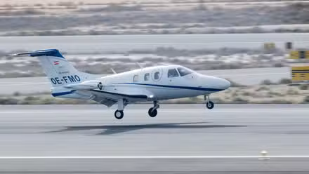 A Mali Air Eclipse 550 about to land on a runway.