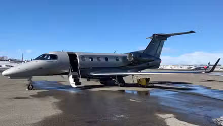 Embraer Phenom 300E flying