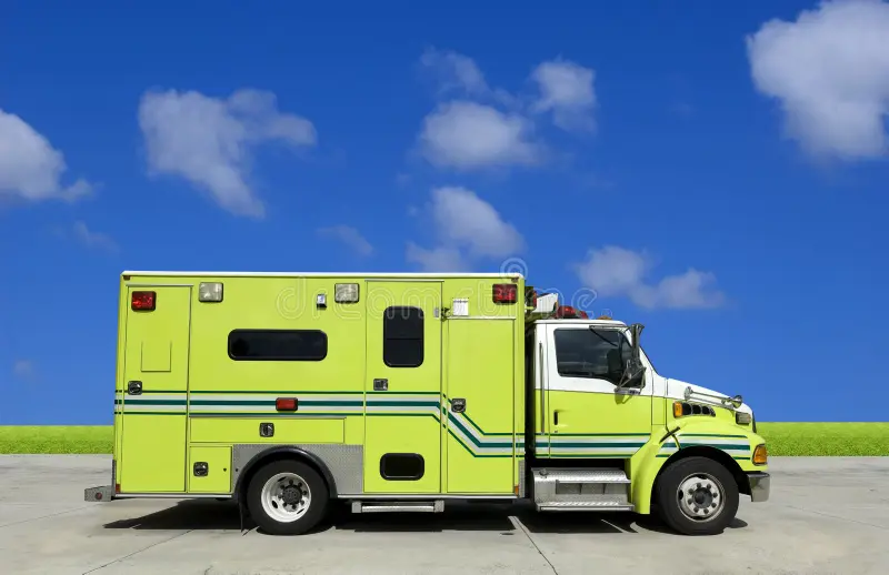 Side view of an ambulance in front of blue sky. Ambulance car side view stock images, royalty-free photos and pictures