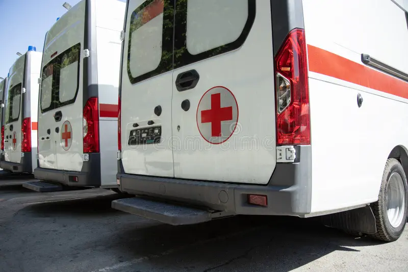 A row of rescuers cars. Side view of an ambulances standing in parking. Back side ambulance stock images, royalty-free photos and pictures