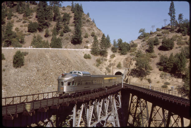 California Zephyr Train Exiting Tunnel on Elevated Track, California, USA, 1964.