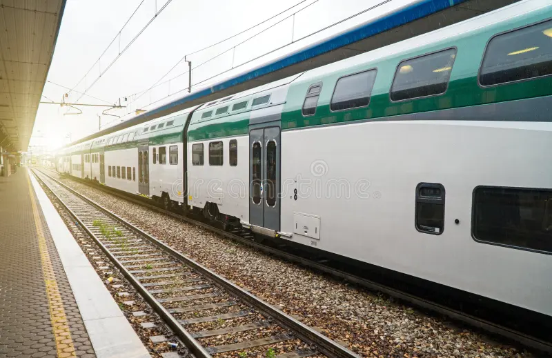 Double-decker train at the railway station in Italy. Double decker train stock images, royalty-free photos and pictures