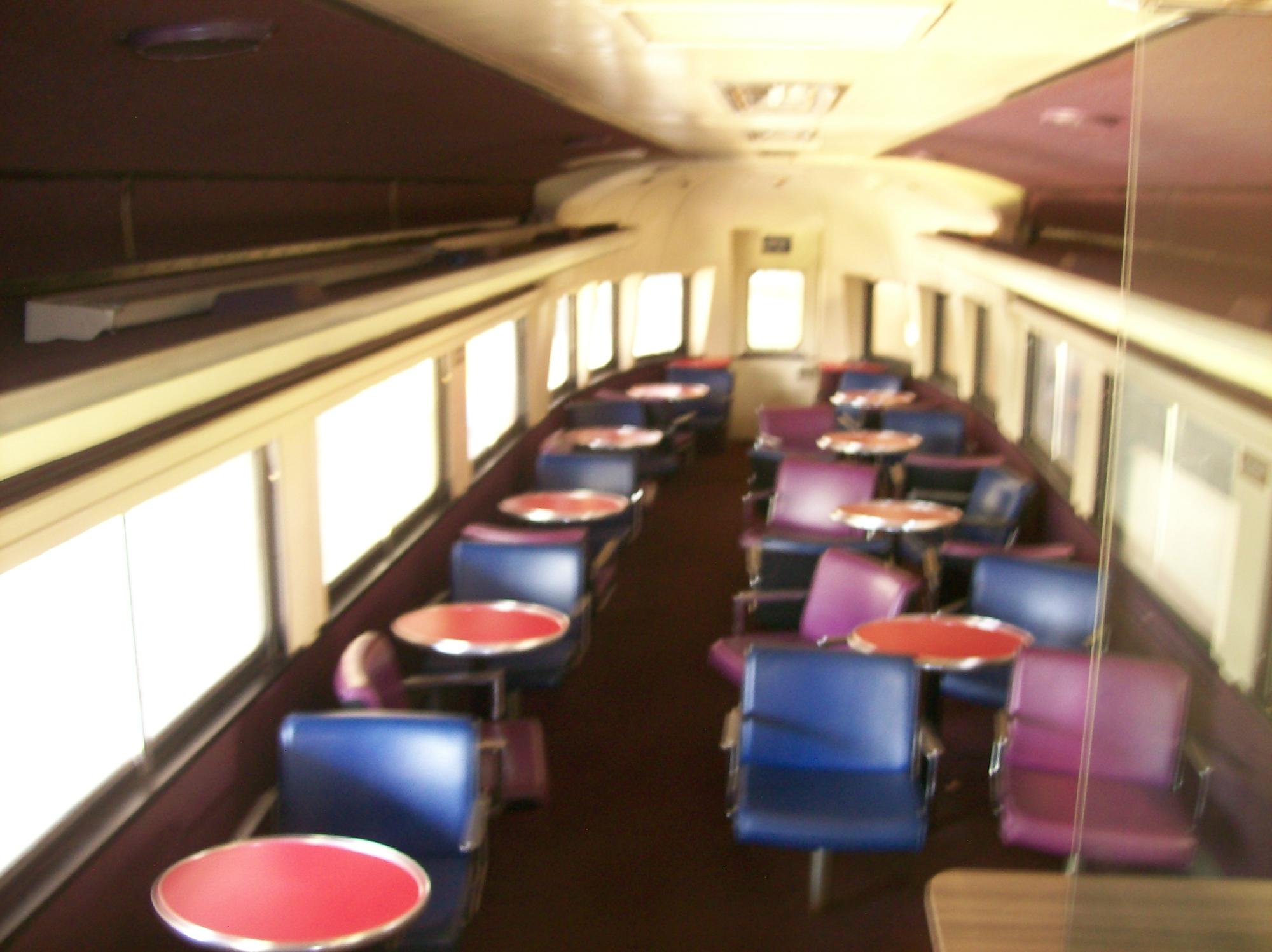 A Vintage Double Decker Train from the Looks of the 70's Color Seating