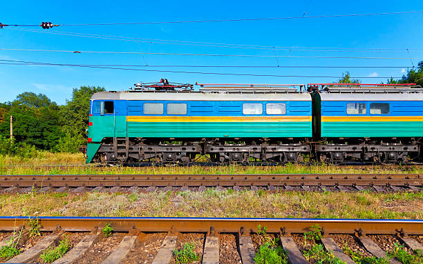Electric locomotive passing by See also: freight-train-side-view stock pictures, royalty-free photos & images
