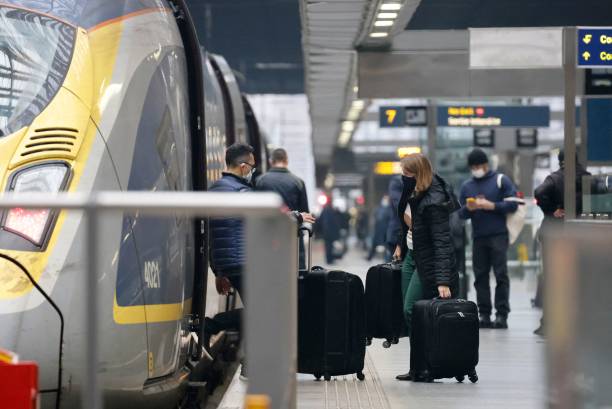Passengers board a Eurostar train at St Pancras International station in London on December 17 the final day before new restrictions are imposed on...