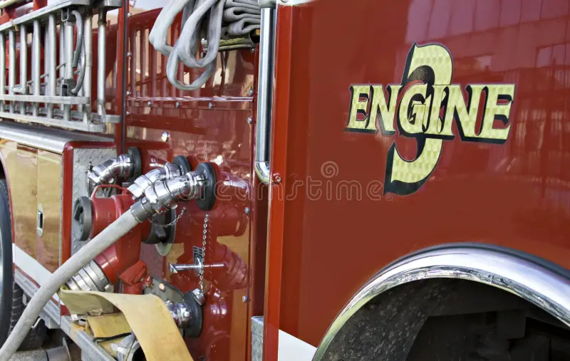 A side detail view of a fire truck - hose connected. Fire truck side view stock images, royalty-free photos and pictures