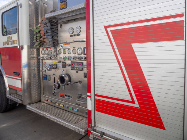 Side view of fire engine Side view of fire engine with control panel side-view-of-a-fire-truck stock pictures, royalty-free photos & images