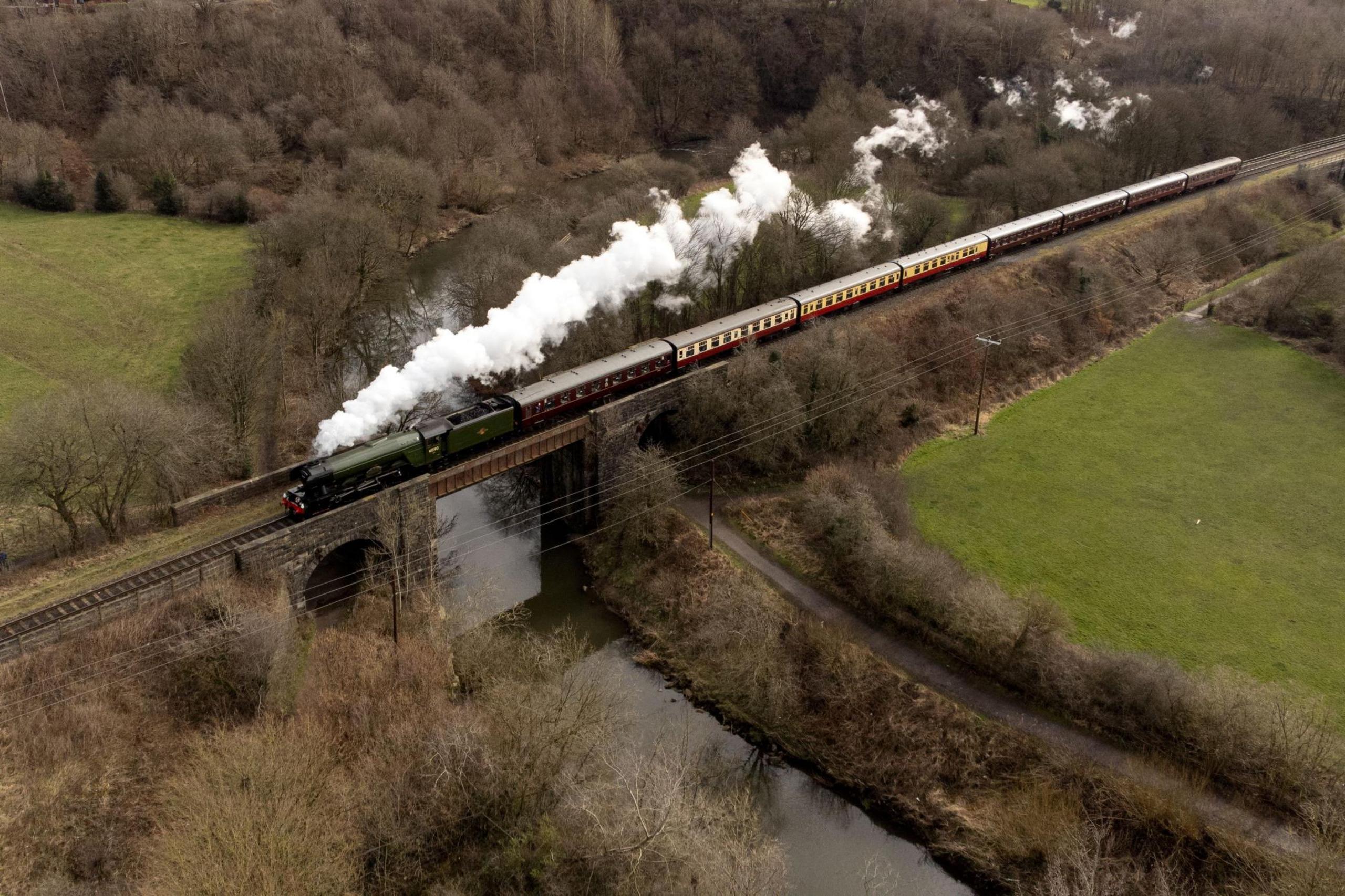 An aerial view shows Flying Scotsman travelling along the East Lancashire Railway on 11 March 2023