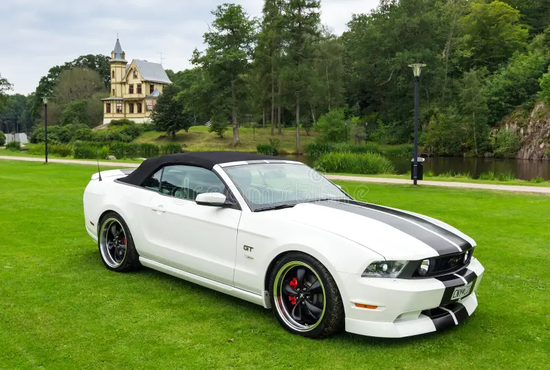 RONNEBY, SWEDEN - AUGUST 09: Summer V8 car fans event Pony & muscle car meet. Front and side view of Ford Mustang model 2010 in 08 August, 2014 in Ronneby, Sweden. Ford mustang side view stock images, royalty-free photos and pictures