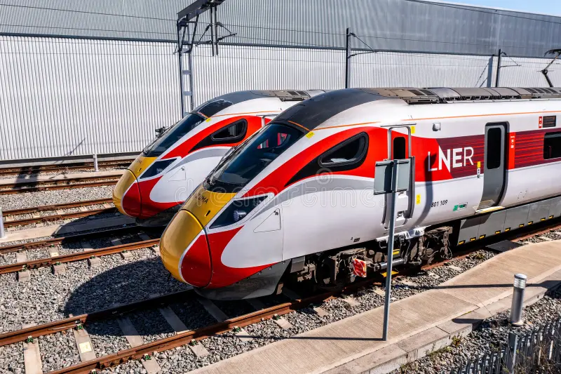 DONCASTER, UK - APRIL, 4 2023. Aerial view of new Hitachi Azuma AT300 Intercity passenger trains in LNER livery on the maintenance depot in Doncaster. Ice train side view stock images, royalty-free photos and pictures