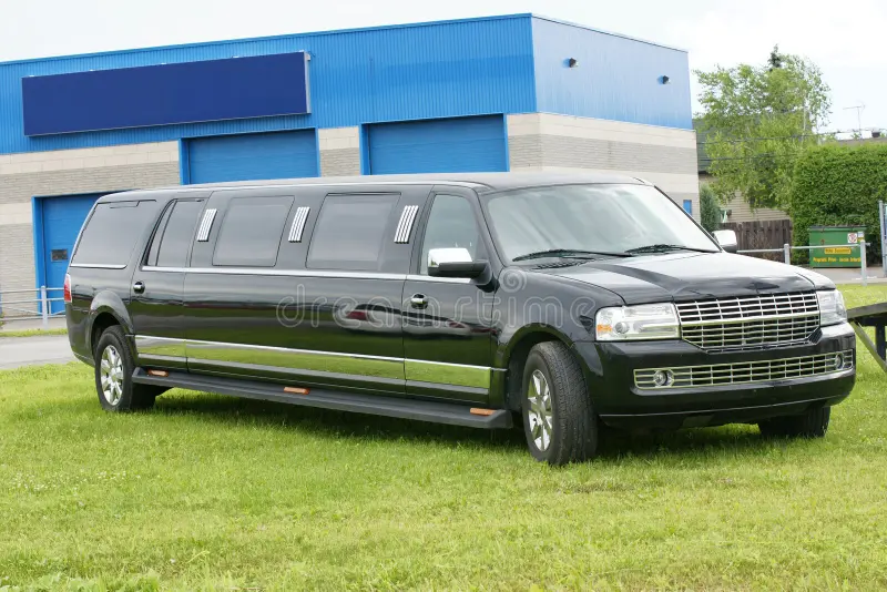 Picture of black limousine parked on the grass. Limousine cars stock images, royalty-free photos and pictures