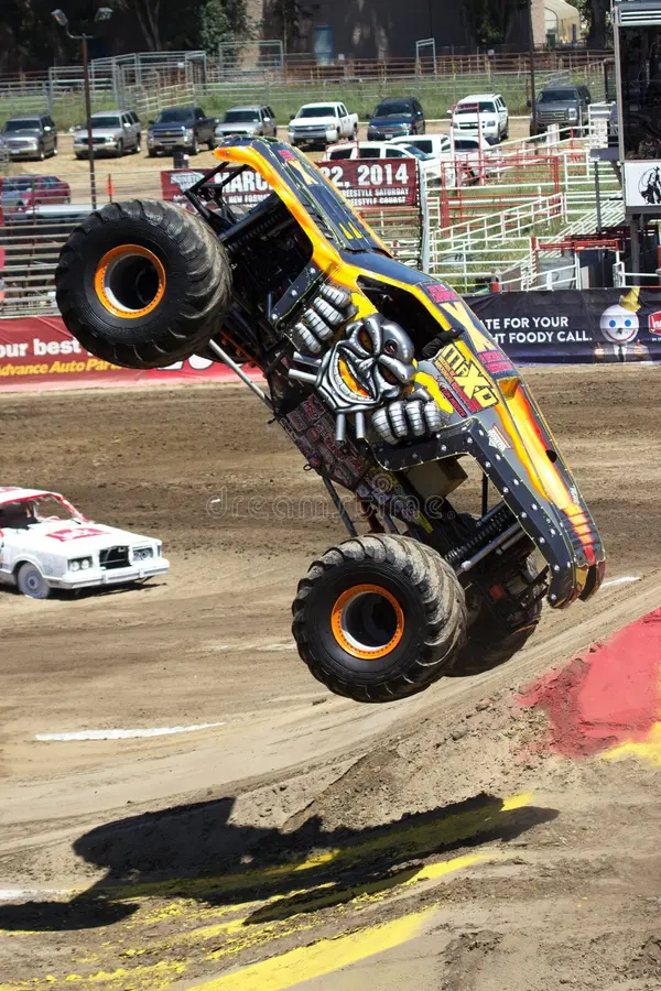 An image of Max-D monster truck in flight at the salinas monster jam event. Monster trucks stock images, royalty-free photos and pictures
