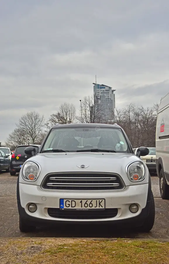 Front view of white Mini Cooper parked in Gdynia in northern Poland. Bmw mini cooper car side view stock images, royalty-free photos and pictures
