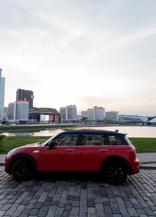 Minsk, Belarus, April 17, 2024 - Side view of red mini cooper parked in the street. Bmw mini cooper car side view stock images, royalty-free photos and pictures