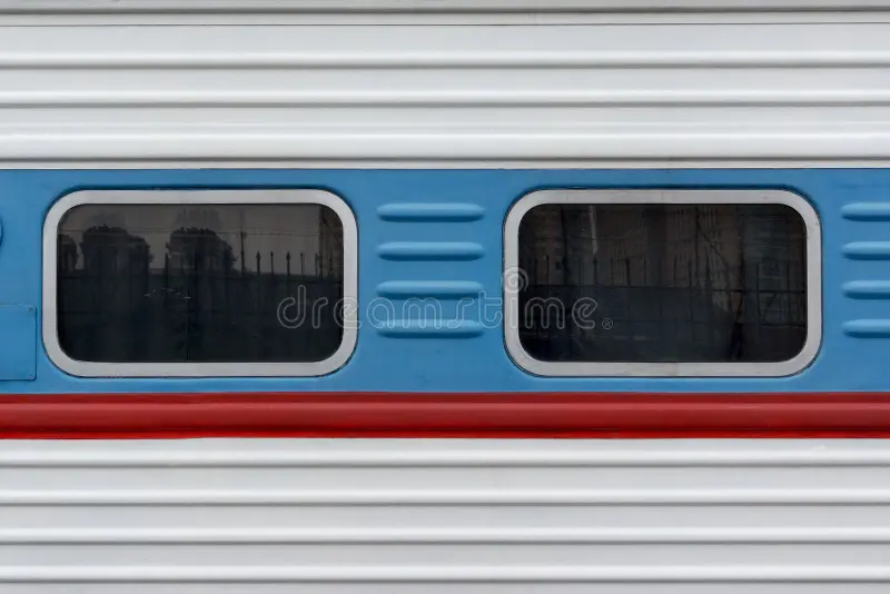 Side view of aged multi-colored passenger coach. Passenger train side view stock images, royalty-free photos and pictures