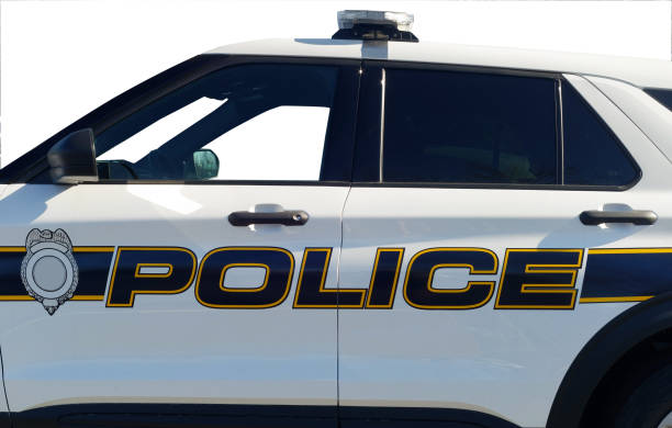 Side view police car Side view of isolated police car with blank emblem. police car side view stock pictures, royalty-free photos & images