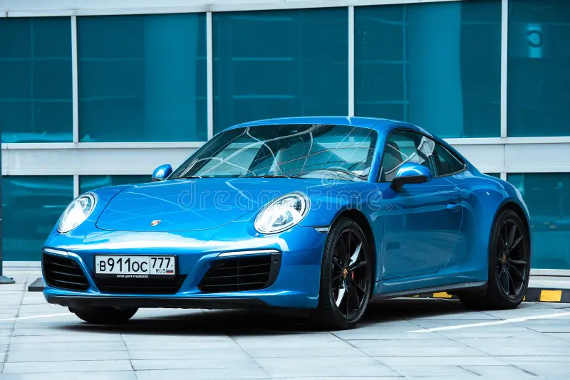 Moscow, Russia - September 2022: Front side view of car Porsche 911 in city area. Blue luxury Porsche 991 parked on the street. Porsche 911 side view stock images, royalty-free photos and pictures