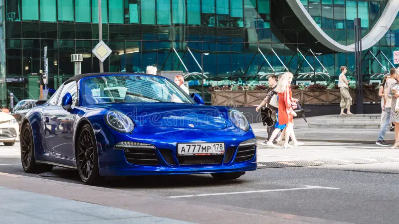 Moscow, Russia - August 2021: Porsche 911 Targa 4 GTS parked on the street in Moscow. Blue color supercar in front of office building. Front side view. Porsche 911 side view stock images, royalty-free photos and pictures