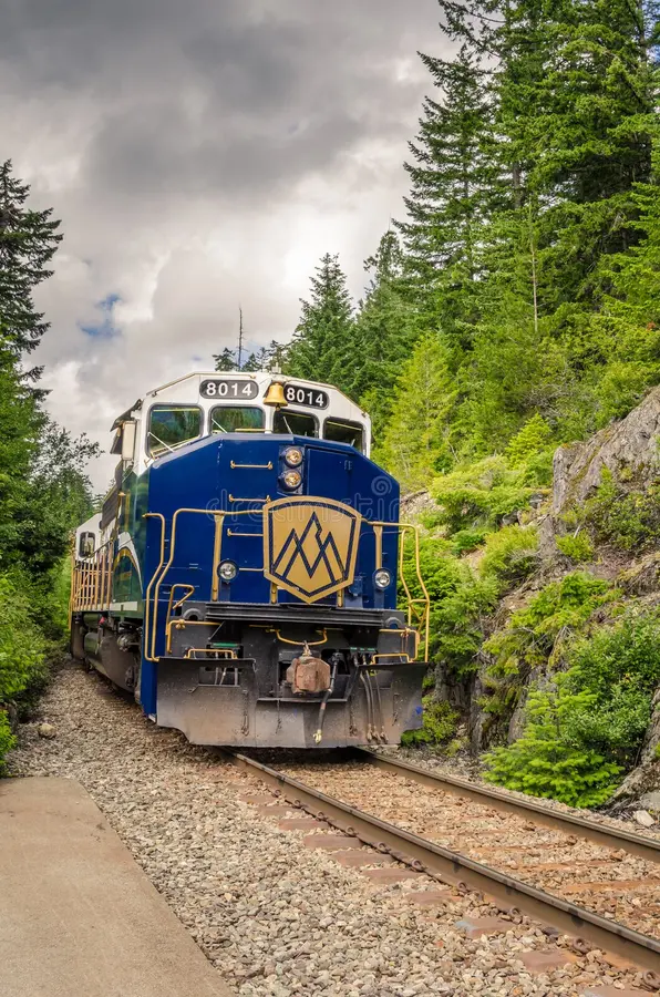 Whistler, BC, Canada - June 28, 2014: Rocky Mountaineer Train getting into the Station. Rocky Mountaineer was founded in 1990, and it has transported more than one million passengers since then. Rocky mountaineer train stock images, royalty-free photos and pictures