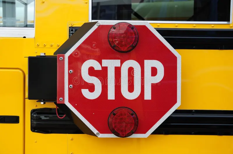 Side view of a school bus and its the stop signal. School bus side view stock images, royalty-free photos and pictures