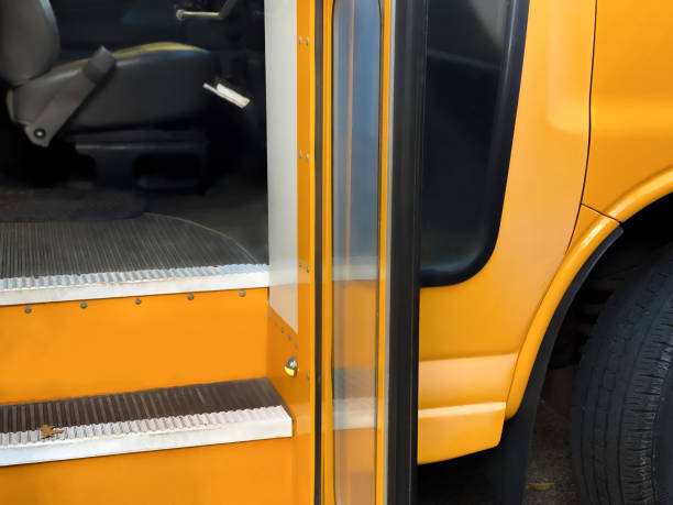 side view of traditional yellow school bus steps & driver’s seat - school bus side view stock pictures, royalty-free photos & images