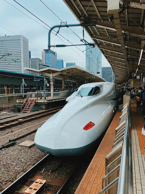 Free A sleek Shinkansen bullet train preparing to depart from Tokyo Station. Stock Photo