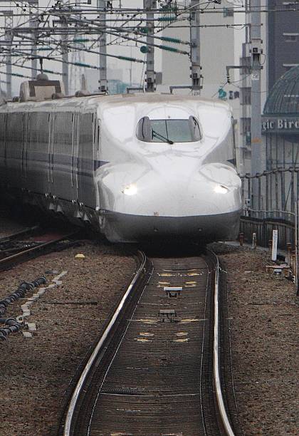 Shinkansen bullet train developed by West Japan Railway Co. And Central Japan Railway Co. Approaches Shin-Osaka Station in Osaka City, Japan, on...